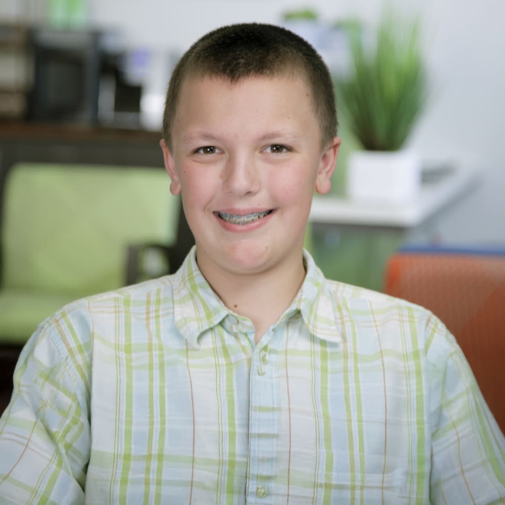 Cole is a patient at Nalchajian Orthodontics. He wears braces to straighten his teeth.